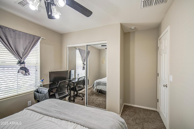 bedroom with carpet, a closet, ceiling fan, and baseboards