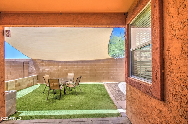 view of yard featuring outdoor dining area