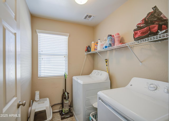 washroom with independent washer and dryer