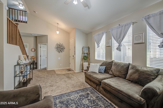 living area with a ceiling fan, stairs, carpet flooring, lofted ceiling, and healthy amount of natural light
