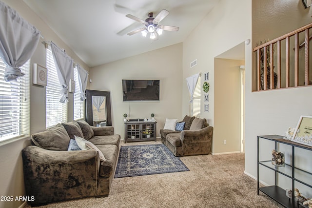 carpeted living room featuring vaulted ceiling and ceiling fan