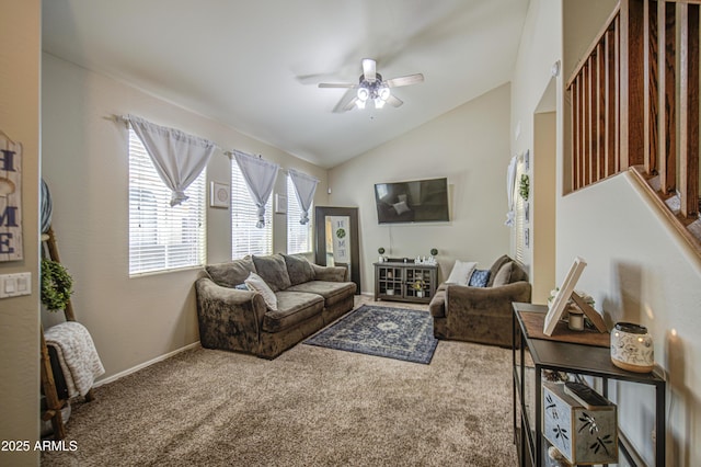 living room with lofted ceiling, ceiling fan, carpet, and baseboards