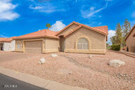 view of front of house with an attached garage and driveway