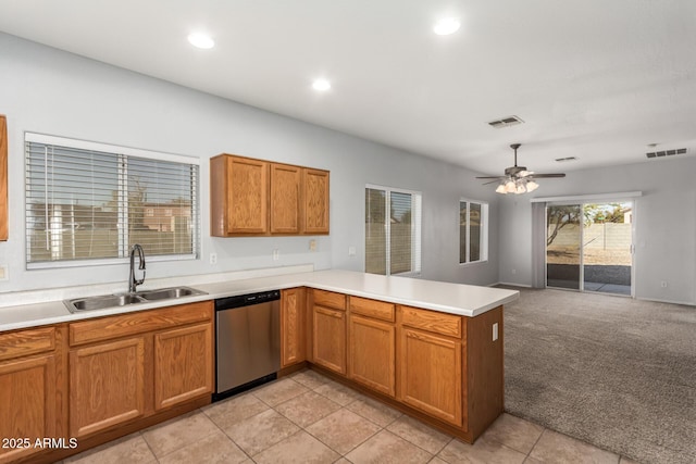 kitchen with dishwasher, sink, ceiling fan, kitchen peninsula, and light carpet