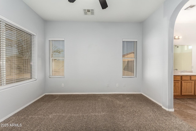 interior space featuring ceiling fan