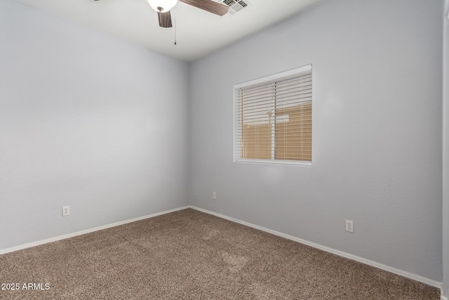 spare room featuring ceiling fan and carpet flooring