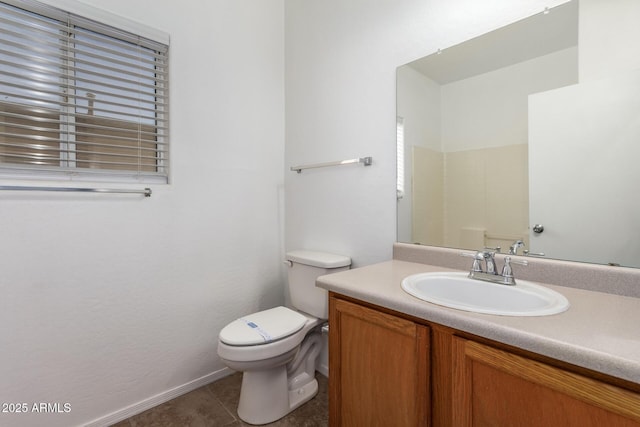 bathroom featuring tile patterned flooring, vanity, walk in shower, and toilet