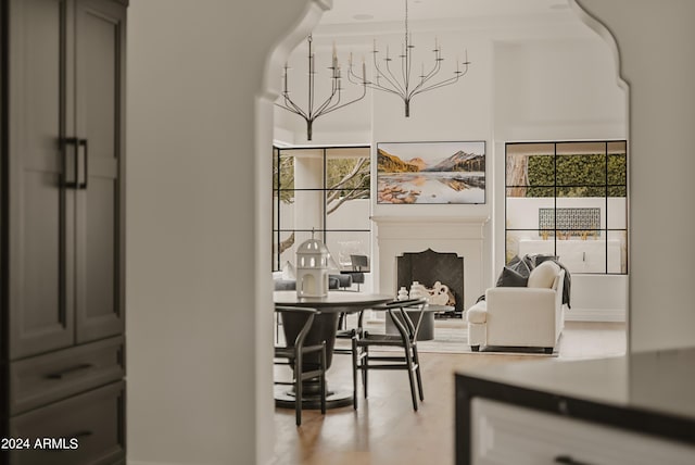 interior space with wood-type flooring and a notable chandelier