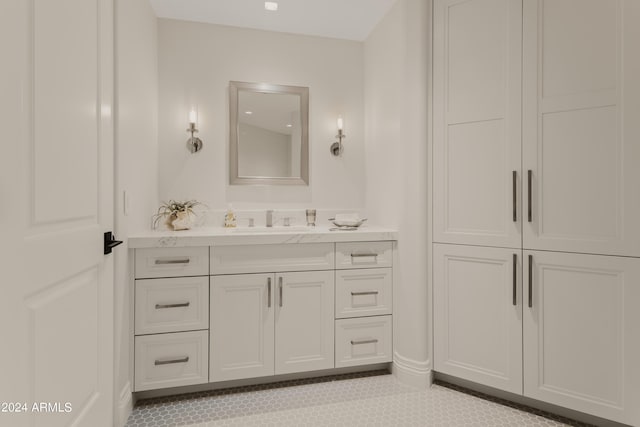 bathroom with tile patterned flooring and vanity