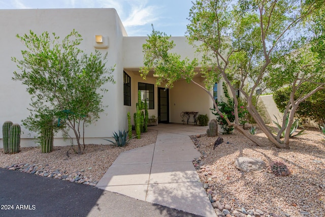 entrance to property with a carport