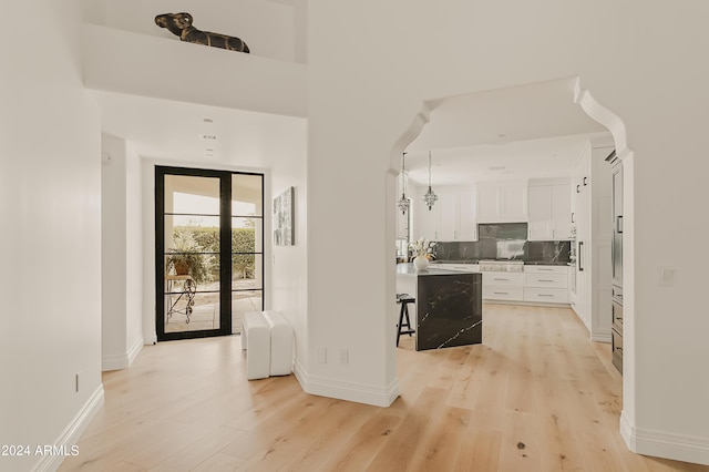 hallway featuring light hardwood / wood-style flooring