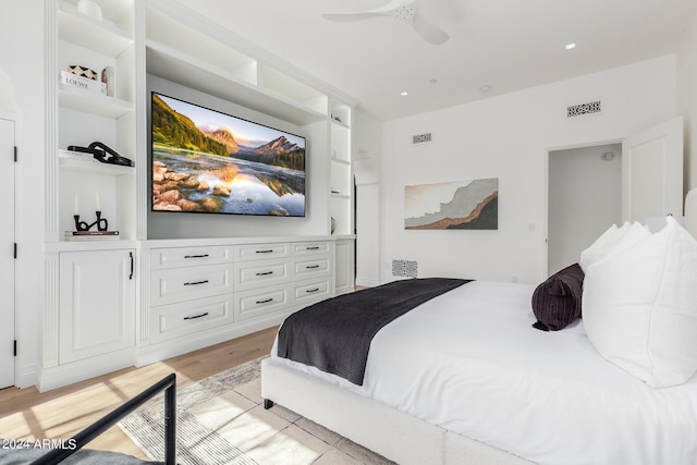 bedroom with light hardwood / wood-style flooring and ceiling fan