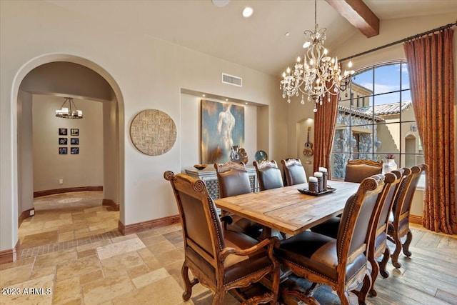 dining room with lofted ceiling with beams