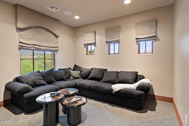 living room featuring a healthy amount of sunlight and light tile patterned floors