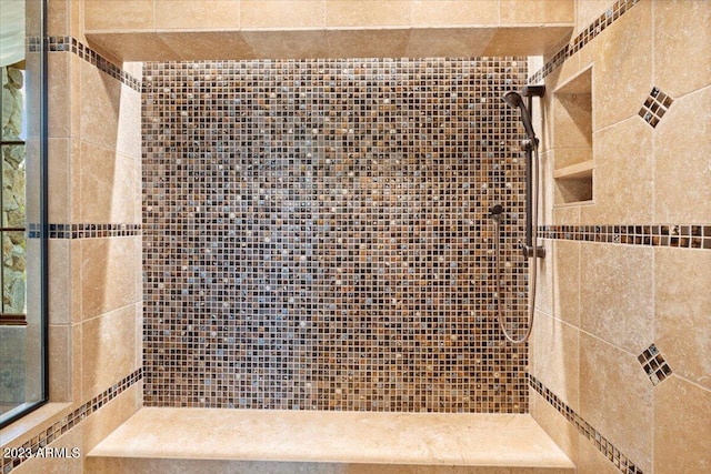 bathroom featuring tiled shower