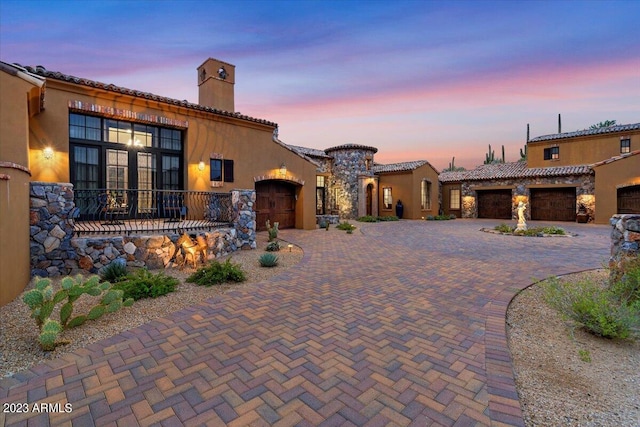 mediterranean / spanish-style house featuring a garage