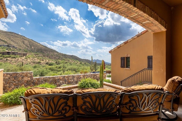 balcony featuring a mountain view