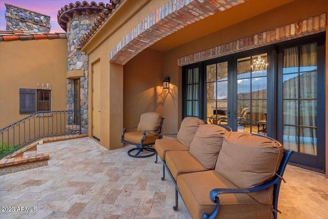 view of patio terrace at dusk