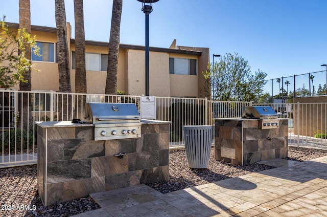 view of patio with a grill and an outdoor kitchen