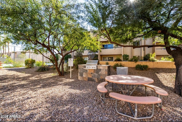 view of yard featuring an outdoor kitchen