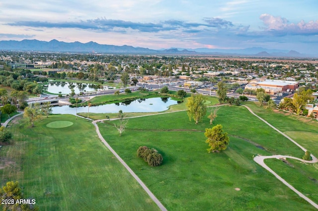 drone / aerial view with a water and mountain view