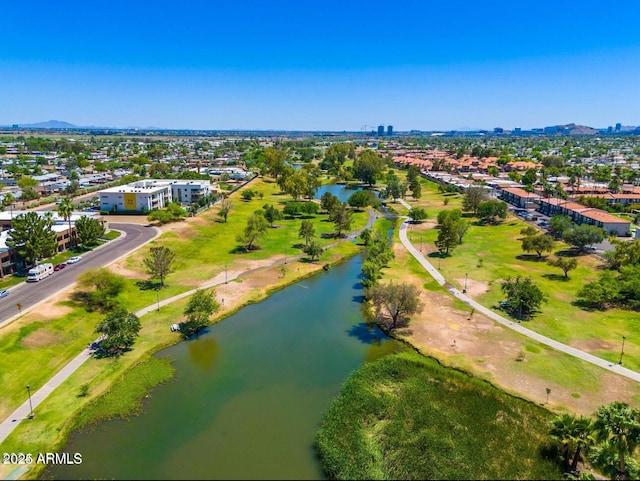 drone / aerial view with a water and mountain view