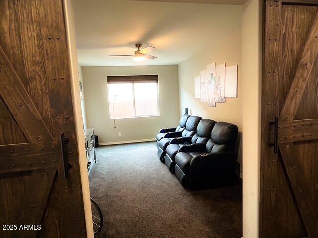 3871 E Harrison St, Gilbert, AZ 85295 - carpeted living area featuring baseboards and a ceiling fan