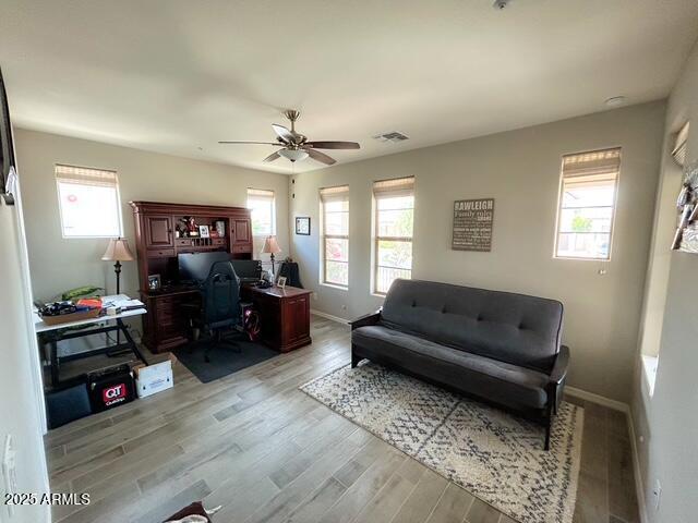 3871 E Harrison St, Gilbert, AZ 85295 - office space featuring ceiling fan, light wood-type flooring, visible vents, and baseboards
