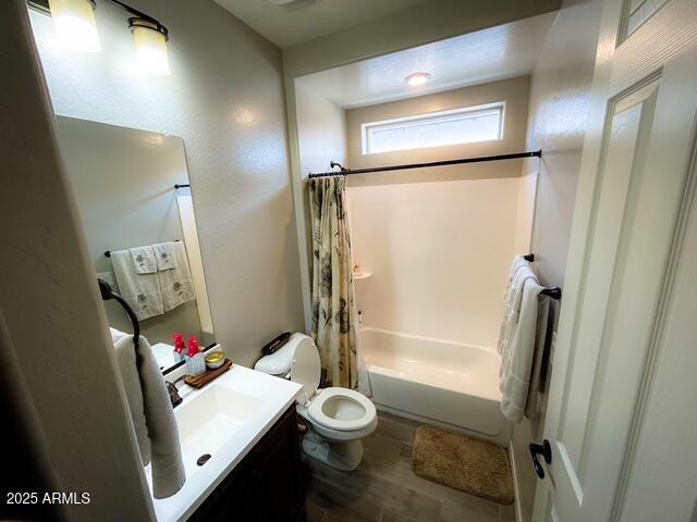 3871 E Harrison St, Gilbert, AZ 85295 - full bath featuring shower / bath combo with shower curtain, toilet, wood finished floors, and vanity