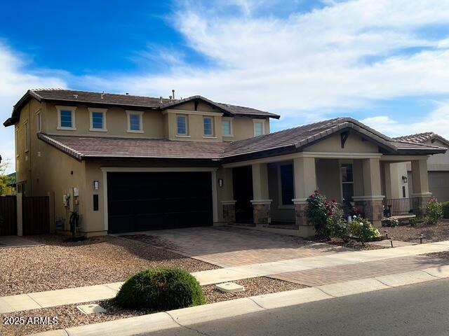 3871 E Harrison St, Gilbert, AZ 85295 - craftsman house with a garage, fence, stucco siding, and decorative driveway