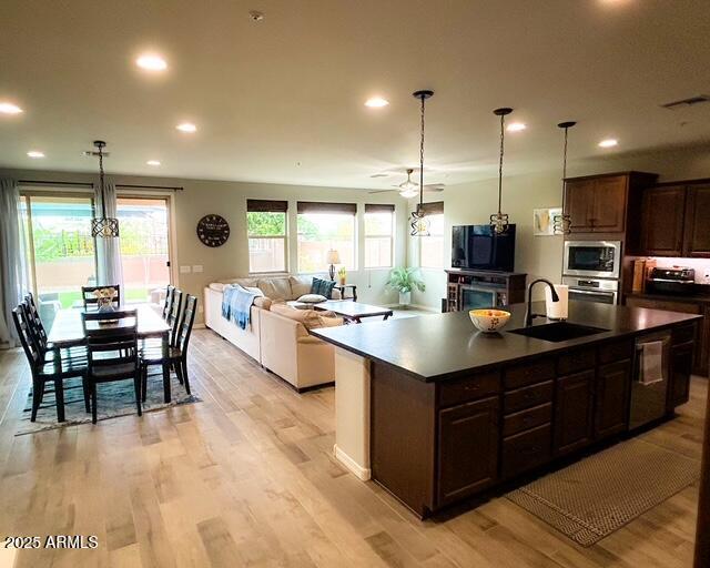 3871 E Harrison St, Gilbert, AZ 85295 - kitchen featuring stainless steel appliances, recessed lighting, light wood-style flooring, and a sink