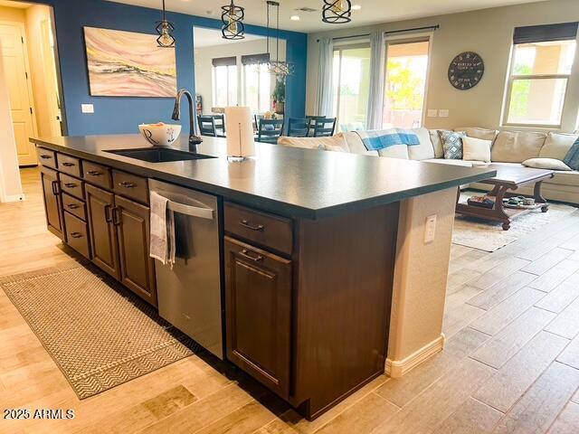 3871 E Harrison St, Gilbert, AZ 85295 - kitchen featuring dark countertops, dishwasher, light wood finished floors, and a sink