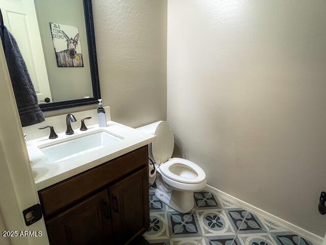 3871 E Harrison St, Gilbert, AZ 85295 - bathroom featuring vanity, toilet, and baseboards