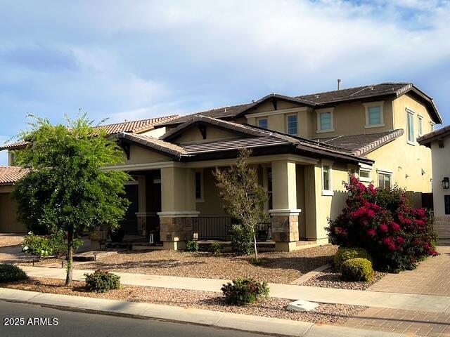 3871 E Harrison St, Gilbert, AZ 85295 - craftsman-style house with covered porch, stucco siding, and stone siding
