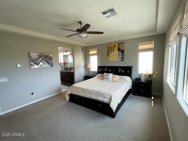 3871 E Harrison St, Gilbert, AZ 85295 - carpeted bedroom featuring baseboards, visible vents, a ceiling fan, and ensuite bathroom