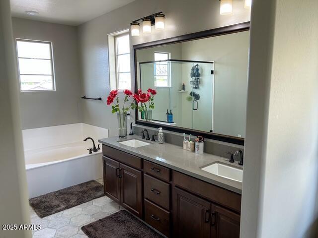 3871 E Harrison St, Gilbert, AZ 85295 - bathroom with a bath, double vanity, a sink, and a shower stall