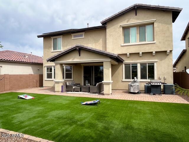 3871 E Harrison St, Gilbert, AZ 85295 - rear view of property with an outdoor hangout area, a fenced backyard, stucco siding, and a patio area