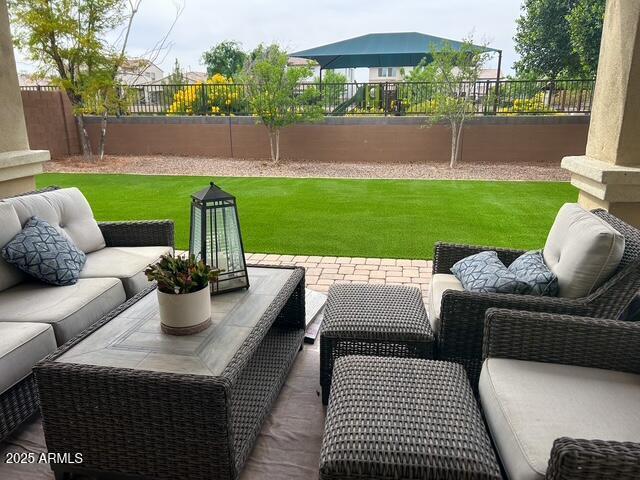 3871 E Harrison St, Gilbert, AZ 85295 - view of patio / terrace with an outdoor hangout area and a fenced backyard