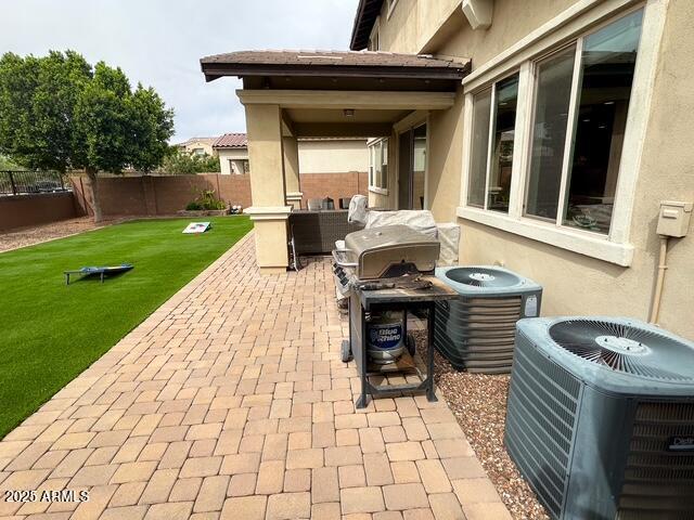 3871 E Harrison St, Gilbert, AZ 85295 - view of patio with area for grilling, cooling unit, and a fenced backyard