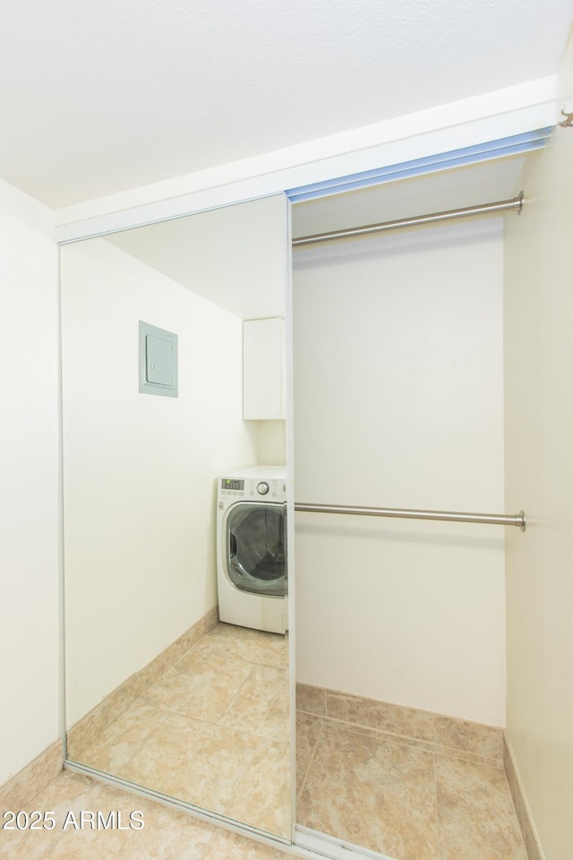 7970 E Camelback Rd Unit 604, Scottsdale, AZ 85251 - washroom with washer / dryer and light tile patterned flooring