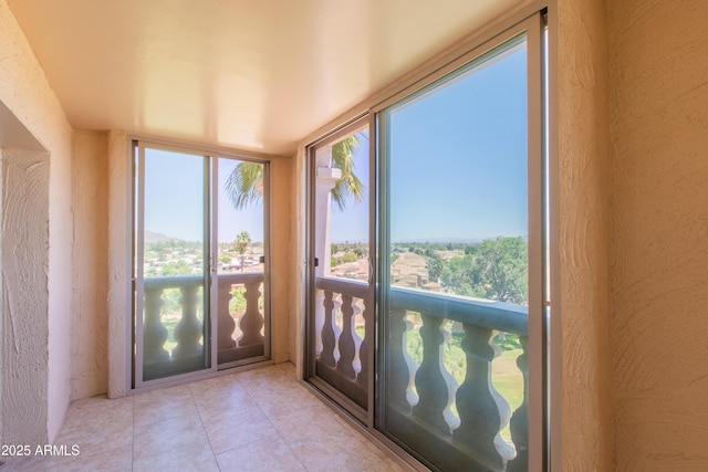 7970 E Camelback Rd Unit 604, Scottsdale, AZ 85251 - unfurnished sunroom featuring tile patterned flooring
