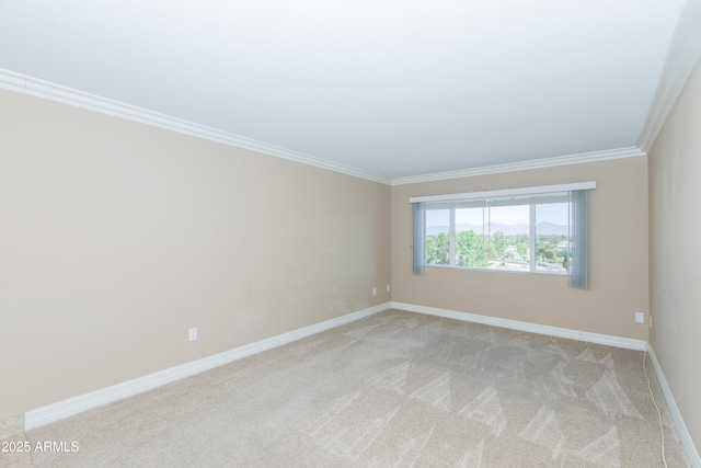 7970 E Camelback Rd Unit 604, Scottsdale, AZ 85251 - unfurnished room featuring crown molding, baseboards, and light carpet