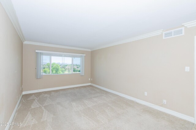 7970 E Camelback Rd Unit 604, Scottsdale, AZ 85251 - unfurnished room featuring ornamental molding, light carpet, and baseboards
