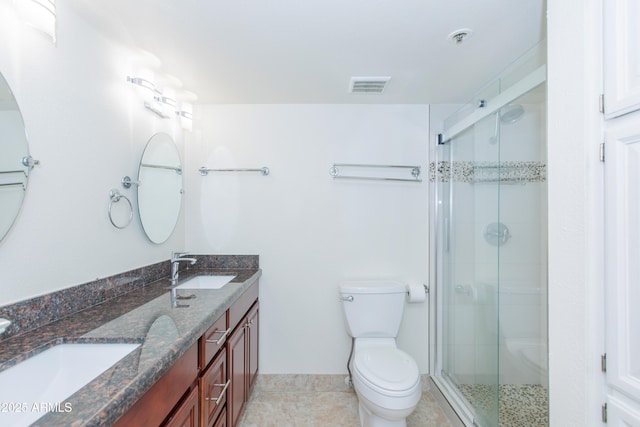 7970 E Camelback Rd Unit 604, Scottsdale, AZ 85251 - full bathroom featuring a shower stall, double vanity, toilet, tile patterned flooring, and baseboards