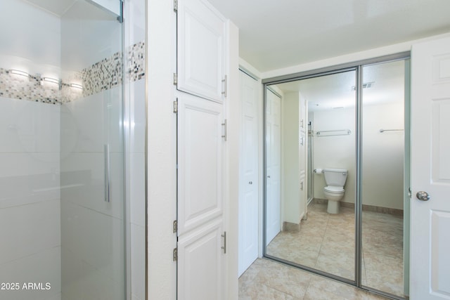 7970 E Camelback Rd Unit 604, Scottsdale, AZ 85251 - full bathroom with toilet, a stall shower, and tile patterned floors