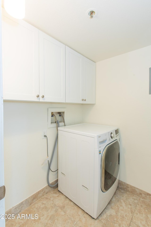 7970 E Camelback Rd Unit 604, Scottsdale, AZ 85251 - laundry area with washer / dryer, cabinet space, and light tile patterned floors