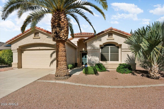 mediterranean / spanish-style house featuring a garage