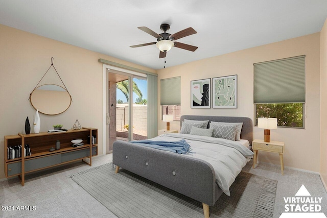 carpeted bedroom with access to exterior and ceiling fan