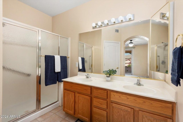 bathroom featuring vanity, an enclosed shower, tile patterned floors, and ceiling fan