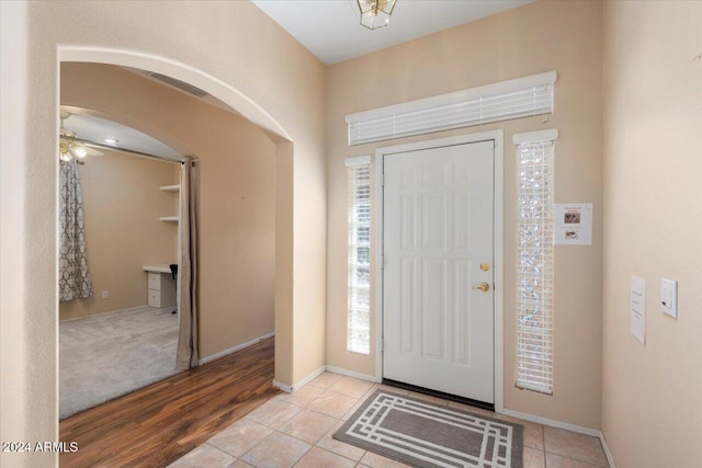 entrance foyer with light wood-type flooring and ceiling fan